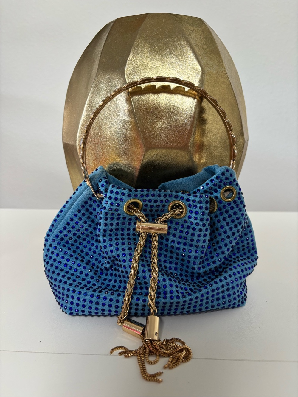 Blue Crystal-Embellished Drawstring Handbag with Gold Handle